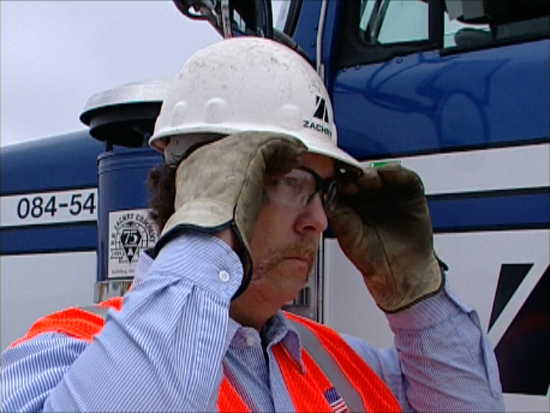 driver putting on eye protection