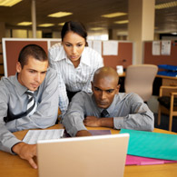 People looking at computer: online training People looking at computer: online training